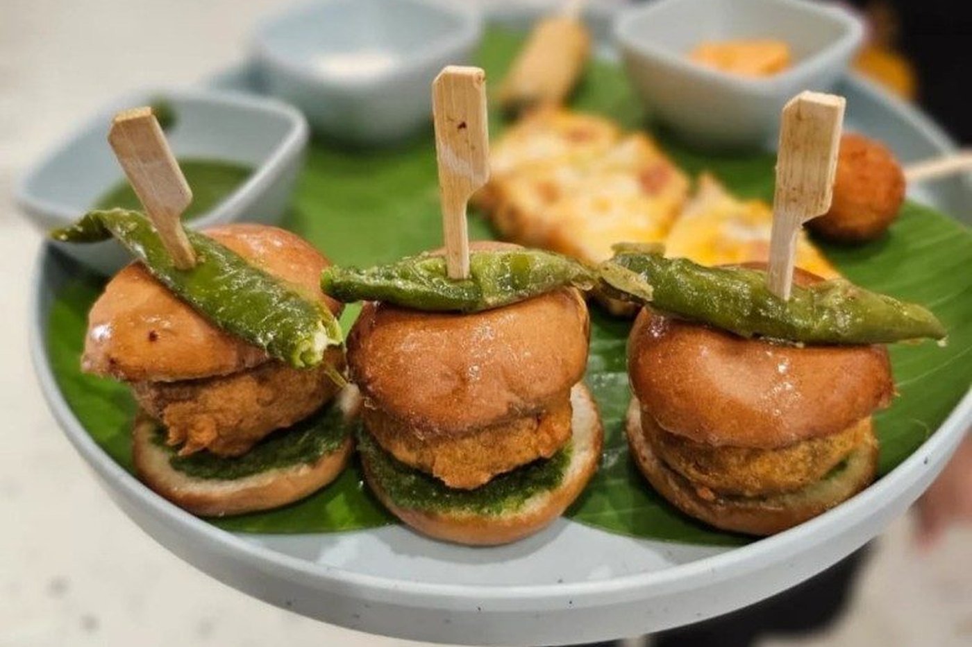 Vada pav sliders and Indian street-food appetizers at a live counter