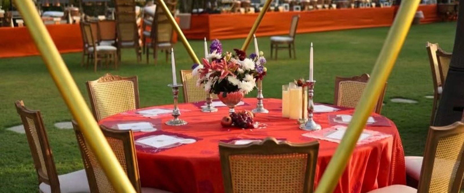 Outdoor destination wedding dining on a lawn with decorated round table and venue setup — Abhijat Catering, Digha, Mandarmani and West Bengal