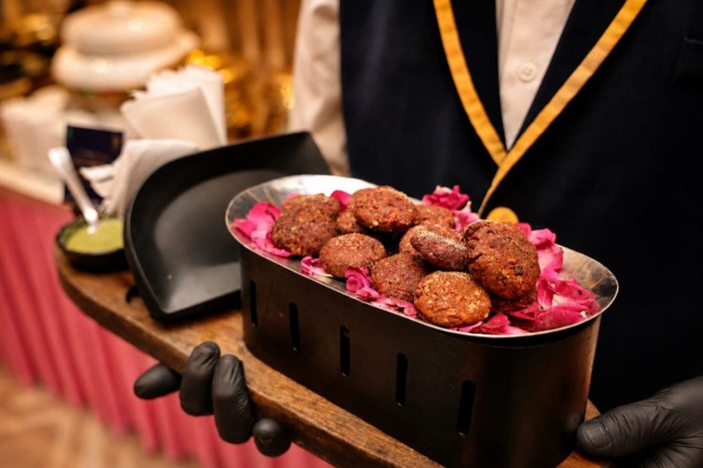 Beetroot kebabs served on rose petals at a private luxury event in Kolkata